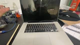 MacBook stuck on black screen