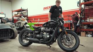 Triumph Bobber Black Gets Big Wheel Kit, Clip-on Bars, and Vance & Hines Pipes