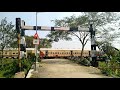 train passing a beautiful railway gate level crossing system india