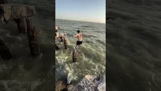 Guy Manages to Jump on a Pillar in the Middle of Water