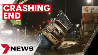 CCTV captures moment truck topples on its side on South Road | 7NEWS