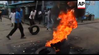 Supporters of opposition leader burn tyres in protest at disputed election