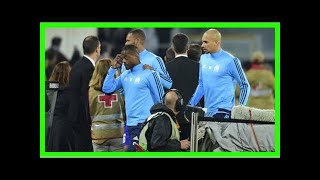 Patrice evra red card: defender dismissed for kicking fan as violence erupts before marseille match