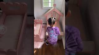 Stormi webster is playing with her cute little doll at her nice house