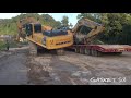 excavator loading on loader