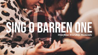 Sing, O barren one