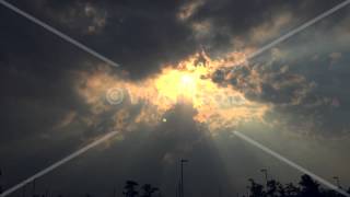 Sun Rays Shining Through Dark Clouds