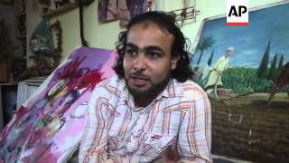 Gazan artist denied travel to West Bank  where his paintings are on show