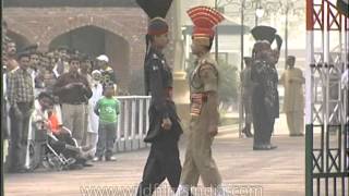 Indian and Pakistan soldier have a friendly hand-shake at Wagah Border