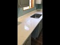 grey cabinets with white carrara quartz countertop