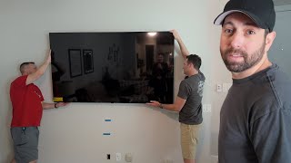 Mounting the New TV with My Best Friends – Teamwork at Its Finest!