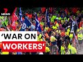 Thousands of angry construction workers march through Brisbane CBD | 7NEWS