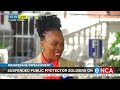 Suspended Public Protector soldiers on