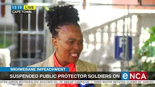 Suspended Public Protector soldiers on