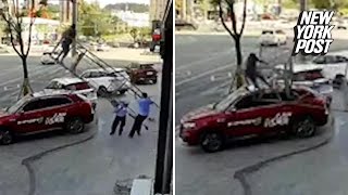 Parked car saves man's fall after scaffolding collapses