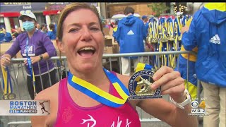 Runners Celebrate At Boston Marathon Finish Line