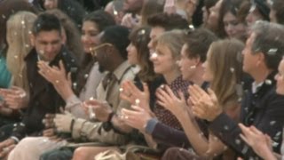 Burberry rain soaks will.i.am, Rosie Huntington-Whiteley, Kate Bosworth \u0026 Anna Wintour at LFW show