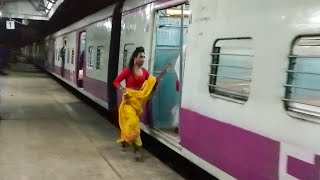 A Reckless Lady is Trying to Board a Running Train in a Very Risky way.