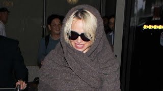 Pamela Anderson Covers Up After Doing Final Nude Playboy Shoot