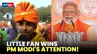 Delhi polls 2025: Child with Modi Placards captures PM Modi's heart at RK Puram rally