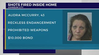 JCPD: Woman charged after firing gun inside occupied building, hitting neighboring home