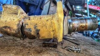 Broken rear axle housing repair by skilled worker