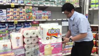 NTUC FairPrice staff sealing up items pulled from shelves