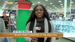 Epiphany La'Sha speaks with Black Friday shoppers at Academy Sports