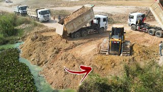 The New Road Construction Starting Project Big Dozer Pouring Soil, Dump Truck Dumping Soil