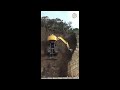 how does this excavator hold itself on the cliff