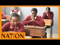 Candidates at Moi Girls’ High School in Eldoret town, pray before the start of the examinations