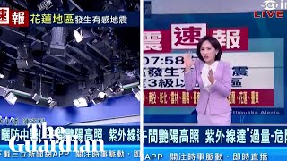 Taiwanese TV anchors continue reading news as earthquake rocks studio
