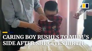 Caring boy in China rushes to mum’s side after she gives birth