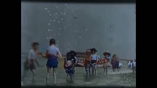 Captivating Moments: Children Enjoying the Beach in 1898 - A Glimpse into the Past🌬🌊💙