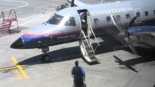 Opening of United Express Embraer 120 door and disembarkation