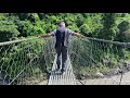 majestic view - crossing a suspension bridge over deep Trishuli river at Kerabari, Chitwan Nepal