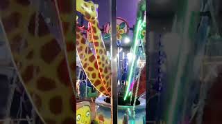 Kids playing merry-go-round at mela