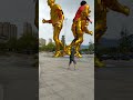 Football kicks the square to touch the feet of men in the Golden Statue original