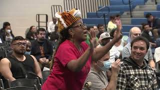 Tempers flare at community meeting about housing migrants at Chicago college