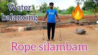 Water balancing rope silambam spinning flow tricks