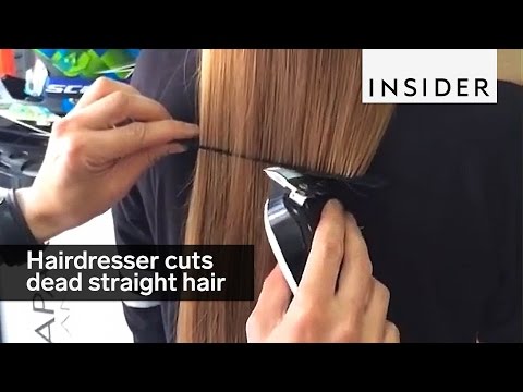 This hairdresser cuts dead straight hair with an electric razor This hairdresser cuts dead straight hair with an electric razor