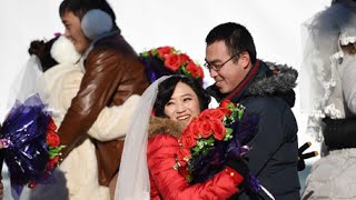 Couples from China and abroad tie knot in outdoor ceremony