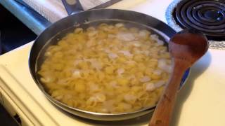 Cooking pasta in a skillet.