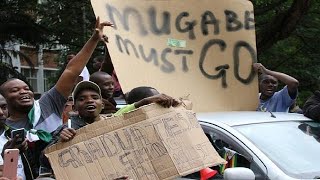 Zimbabwe's ruling party set to sack Mugabe on Sunday, as protesters march in Harare