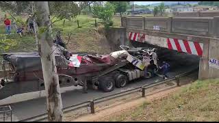 Recovery of side tipper truck that crashed into a low bridge in Volksrust