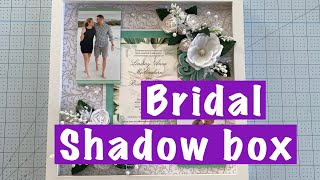 DIY this wedding shadow box with photos and invitation