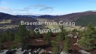 Aerial HD view of Braemar, Scotland from high point on Creag Choinnich