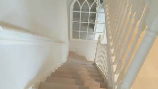 Grey oak wooden floor and matching stair cladding in Battersea