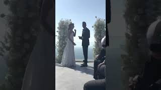Wind Whips Veil From Bride's Head During Wedding Ceremony