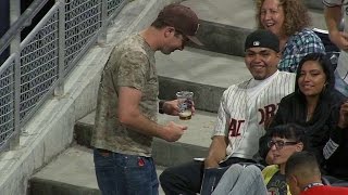 ARI@SD: Fan takes a foul in the stomach, spills beer